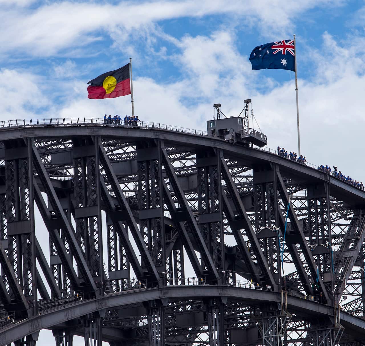 The Australian and the Aboriginal flags on top of the Sydney Harbour Bridge.