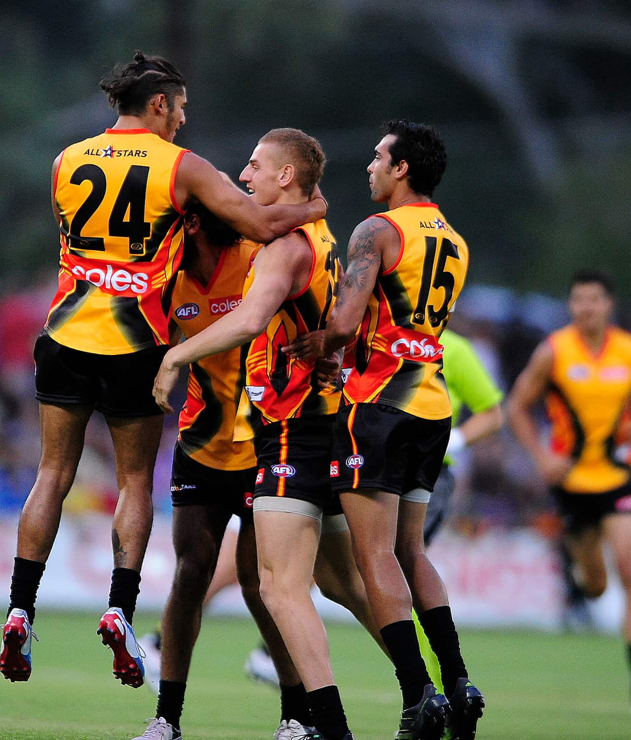 Sharrod Wellingham (left) and Courtney Dempsey (right) celebrate during AN AFL pre-season match (AAP)