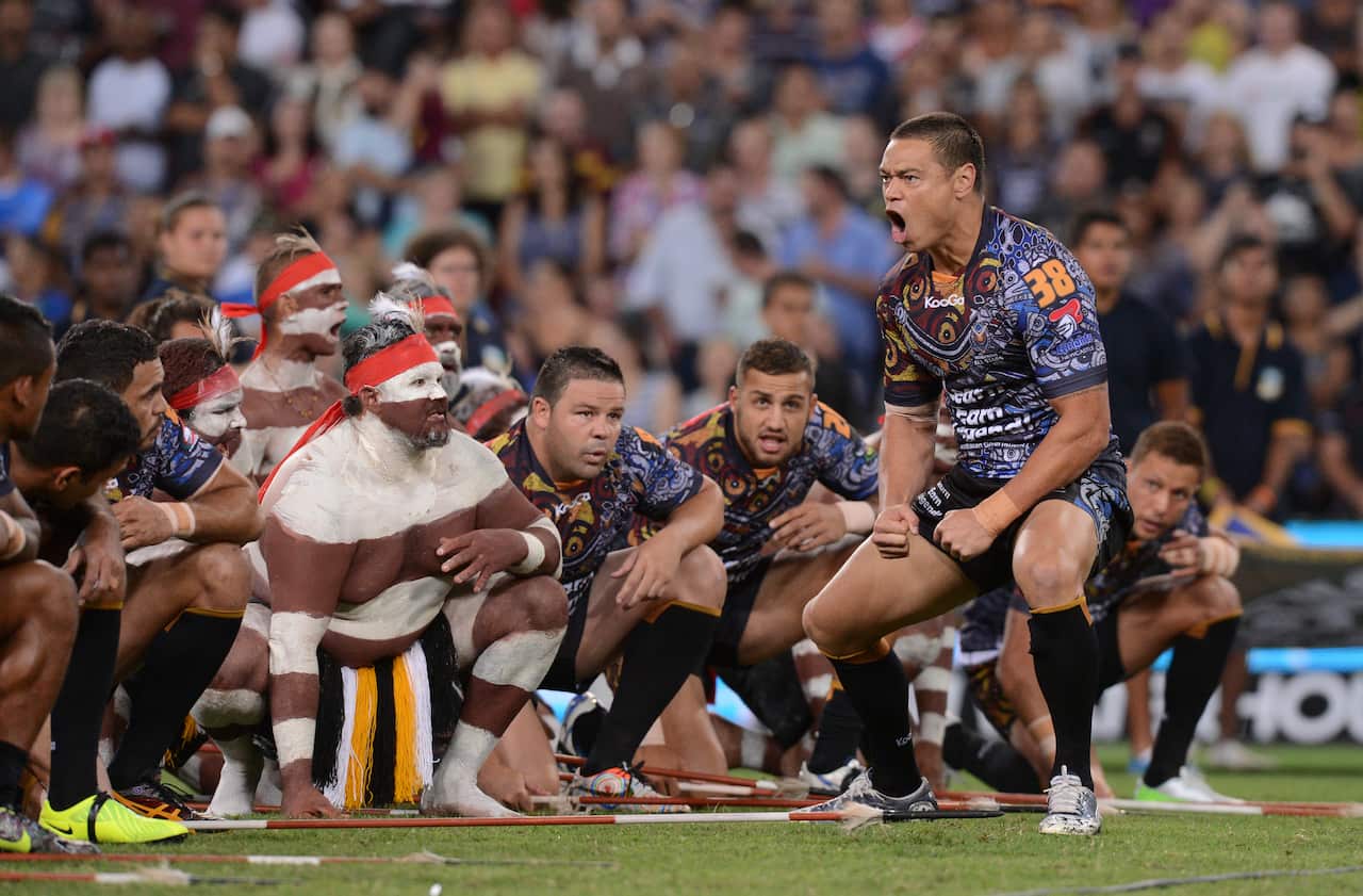 Timana Tahu of Indigenous All Stars leads a war cry before the game between the Indigenous All Stars v NRL All Stars match at Suncorp Stadium in Brisbane, Saturday, Feb. 9, 2013.  (AAP Image/Dave Hunt) NO ARCHIVING, EDITORIAL USE ONLY