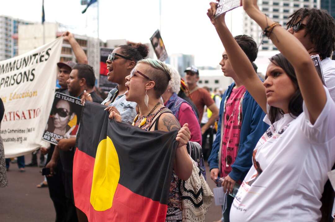Protesters angry over Aboriginal deaths in custody gather outside WA Parliament House.