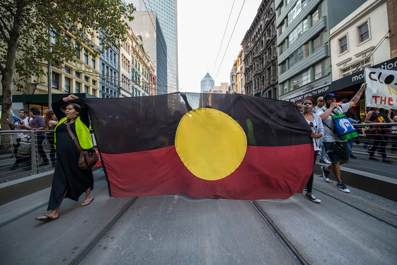 Thousands of protesters rally in Melbourne on May 1, 2015 to call on the government to abandon plans for the closure of up to 150 remote communities.Demonstrators held a peaceful sit-in in the intersection of Swanston and Flinders streets.