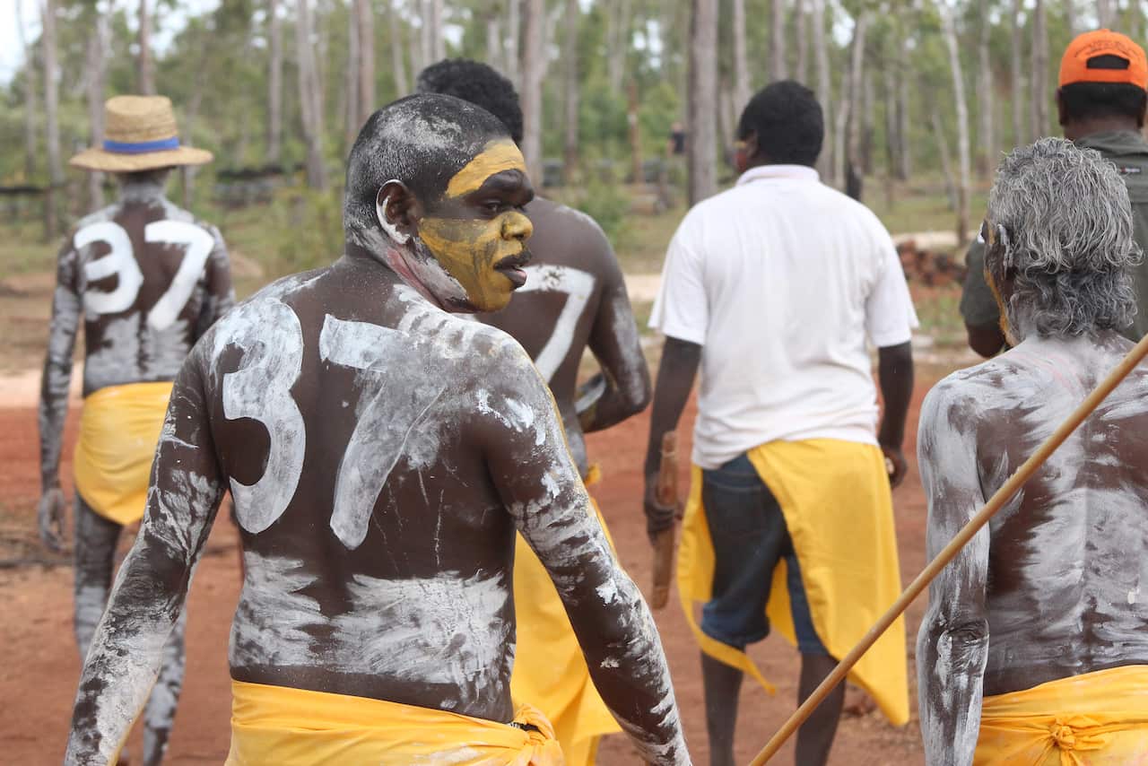 Yolngu men at Garma Festival in north-east Arnhem Land, NT, is painted in a Sydney Swans jersey with a number 37 to support AFL star Adam Goodes.