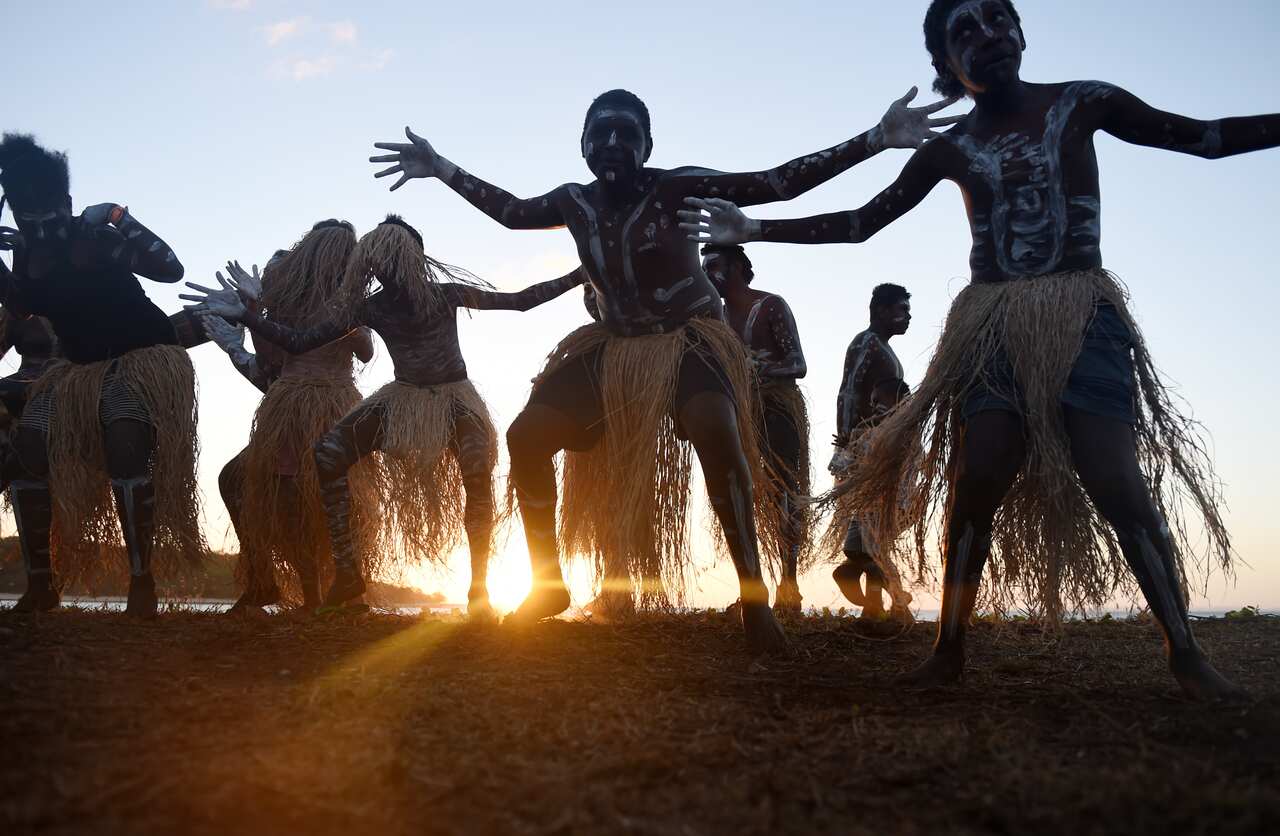 The Injinoo Dance Group rehearse before performing during a welcome to country ceremony for Australian Prime Minister Tony Abbott 