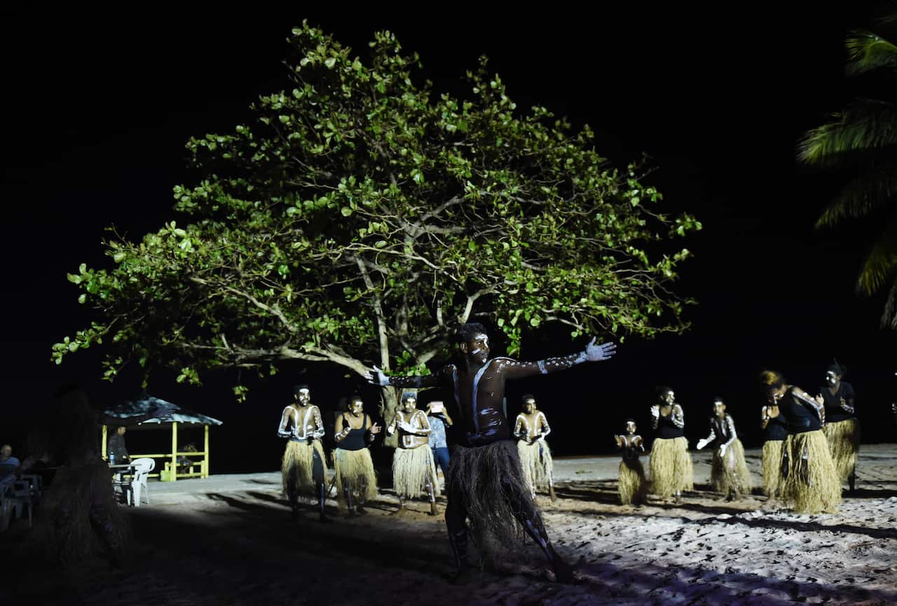 The Injinoo Dance Group perform a welcome to country for Australian Prime Minister Tony Abbott on the Injinoo Foreshore, Bamaga in the Northern Peninsula area, Tuesday, Aug. 25, 2015.