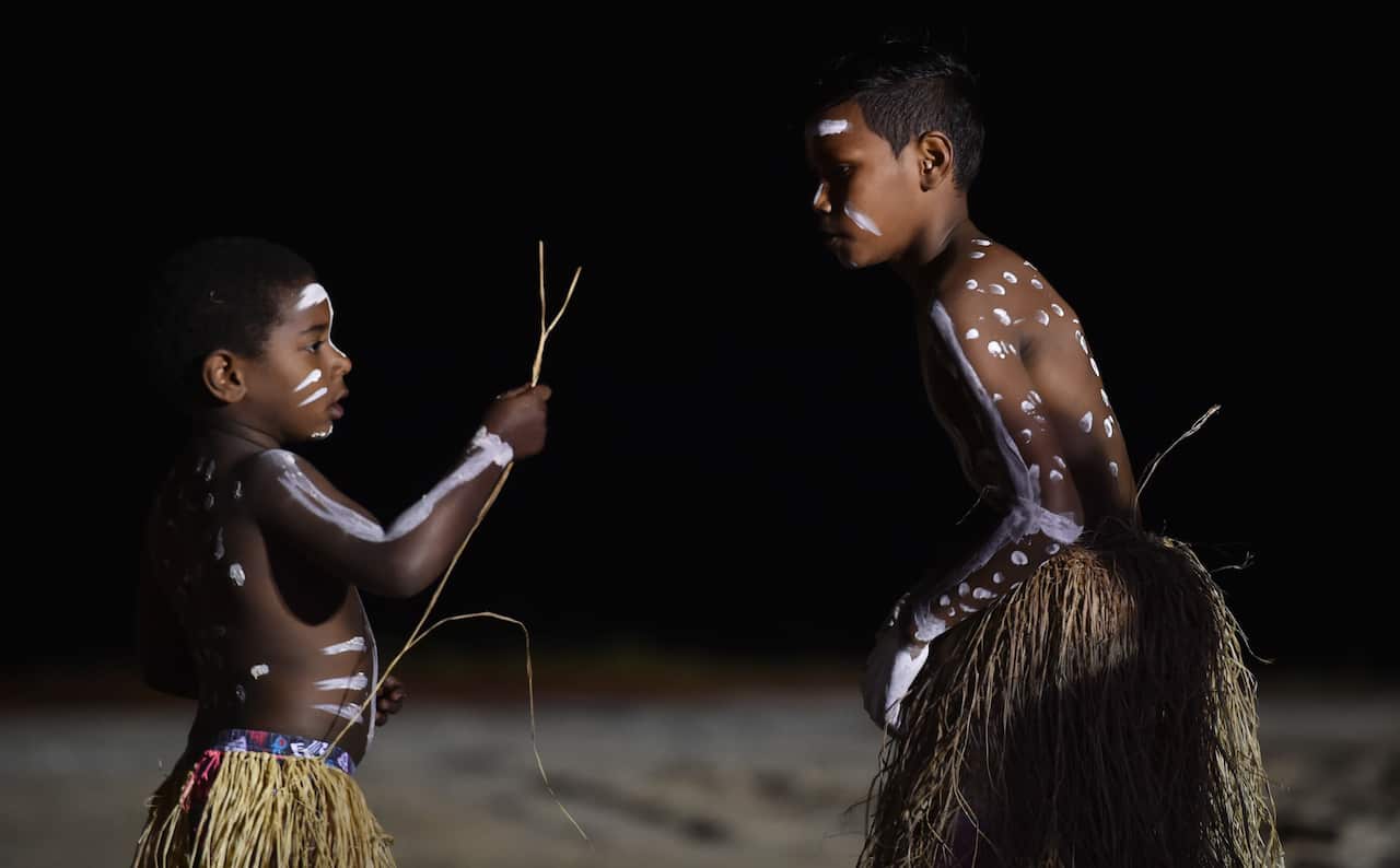 The Injinoo Dance Group perform a welcome to country for Australian Prime Minister Tony Abbott on the Injinoo Foreshore, Bamaga in the Northern Peninsula area, Tuesday, Aug. 25, 2015.