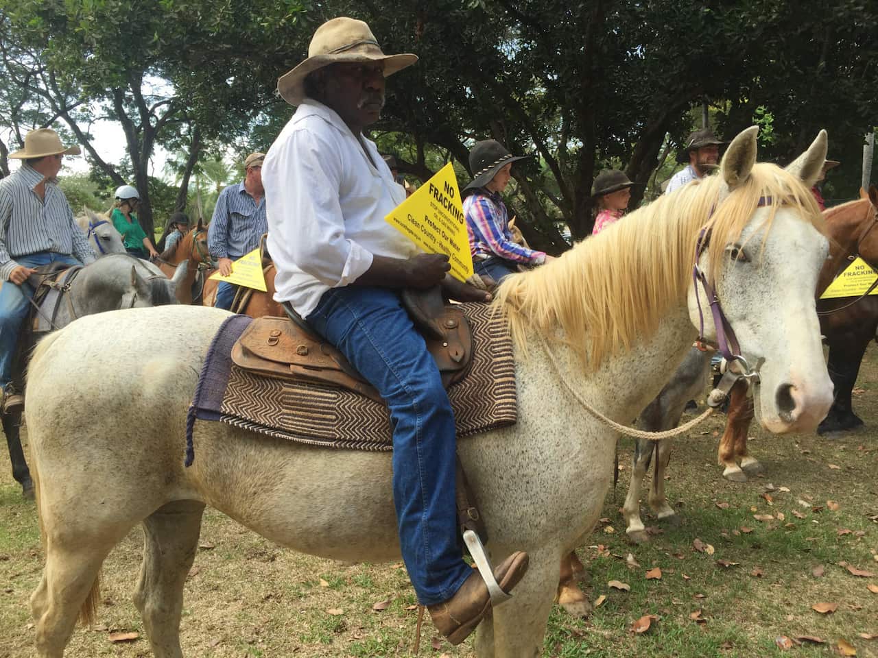 A fracking protester on a horse, marching against the NT parliament to protest the controversial mining practice of fracking