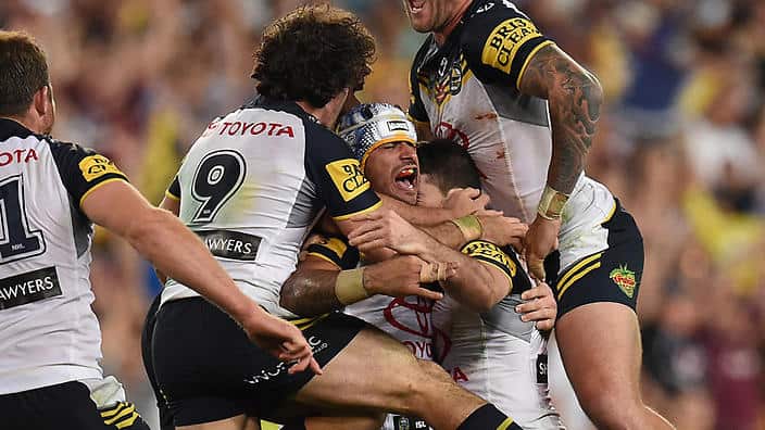The Cowboys captain Johnathan Thurston (centre) celebrates with his team mates their win over the Bronco's in the NRL Grand Final