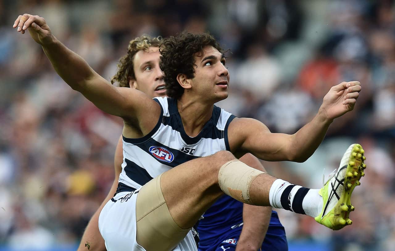 Nakia Cockatoo (right) of the Cats kicks a a goal during the round 7 AFL match between the Geelong Cats and West Coast Eagles at Simonds Stadium in Geelong, Saturday, May 7, 2016. (AAP Image/Julian Smith) NO ARCHIVING, EDITORIAL USE ONLY