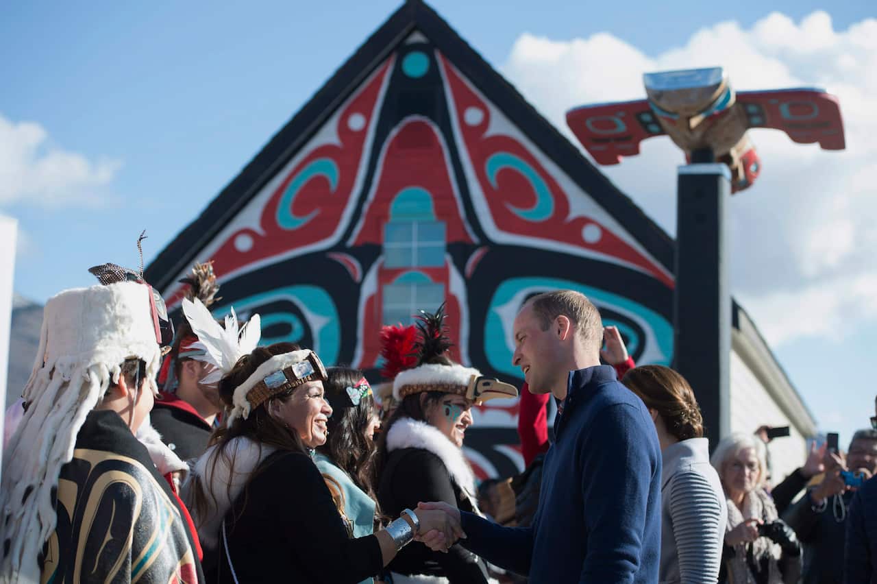 Britain's Prince William and his wife Kate, the Duke and Duchess of Cambridge, greet residents during a welcoming ceremony in Carcross, Yukon, Wednesday, Sept. 28, 2016. (Jonathan Hayward/The Canadian Press via AP)