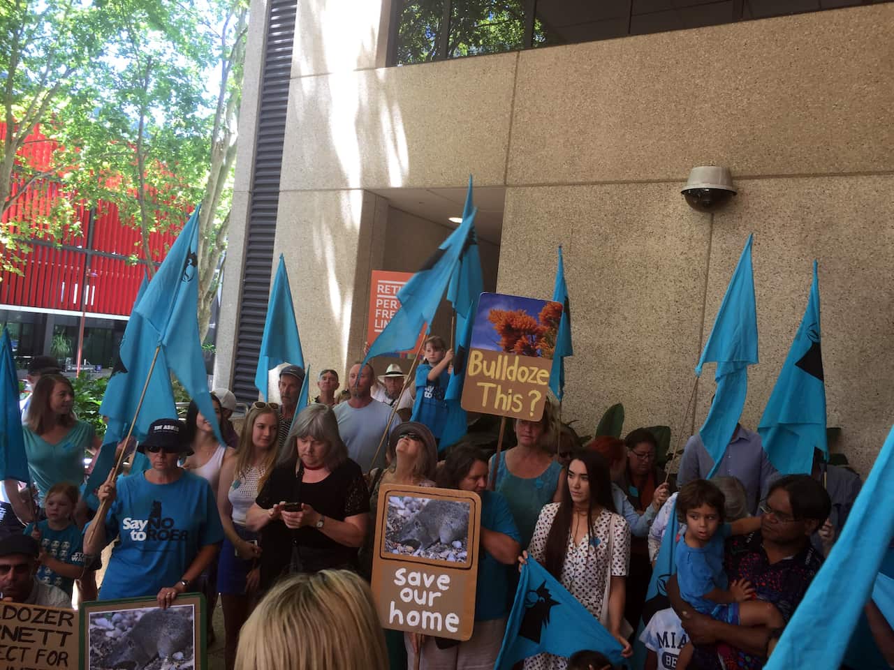 Protesters hold placards outside court, Perth, WA Save Roe 8