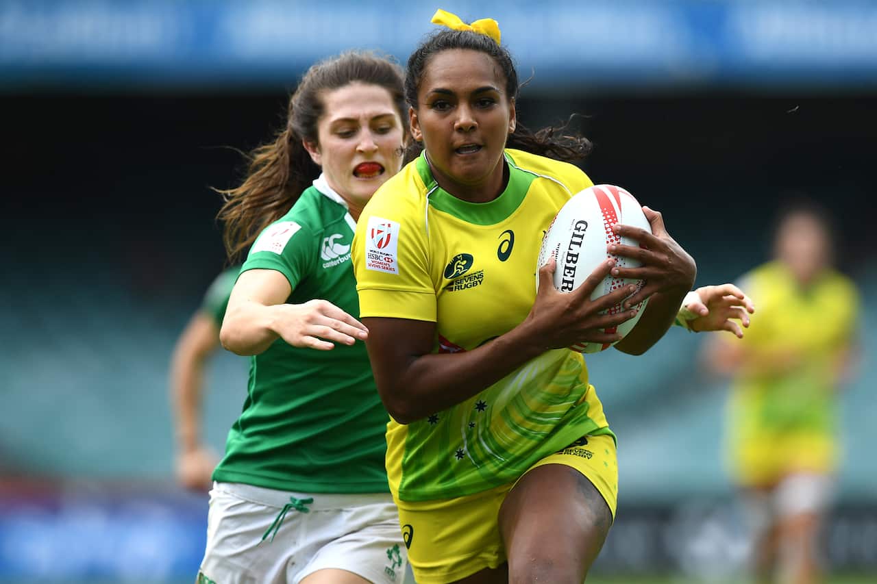 Mahalia Murphy of Australia is tackled by Amee Leigh Murphy Crowe of Ireland during the Women's Pool match of the Sydney Rugby 7s Series in Sydney, Friday, Feb. 3, 2017. (AAP Image/Dan Himbrechts) NO ARCHIVING