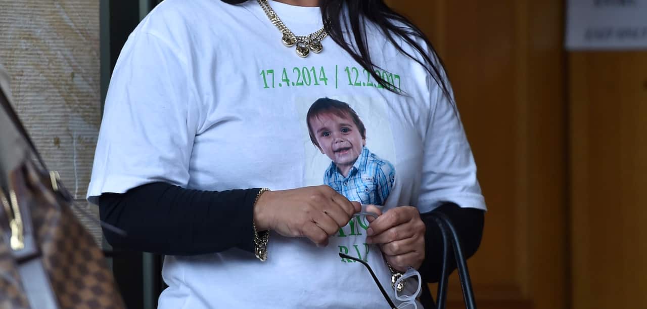 Supporters of the two-year-old Zayne Colson, who was killed in a hit and run, wear printed t-shirts with him on it outside the court. 