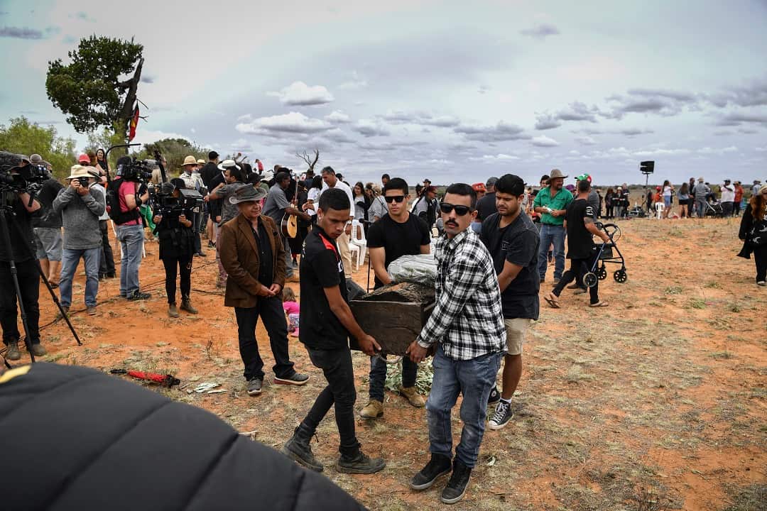 Crowds gather to witness the burial of 'Mungo Man' during a repatriation ceremony at Lake Mungo, 2017.