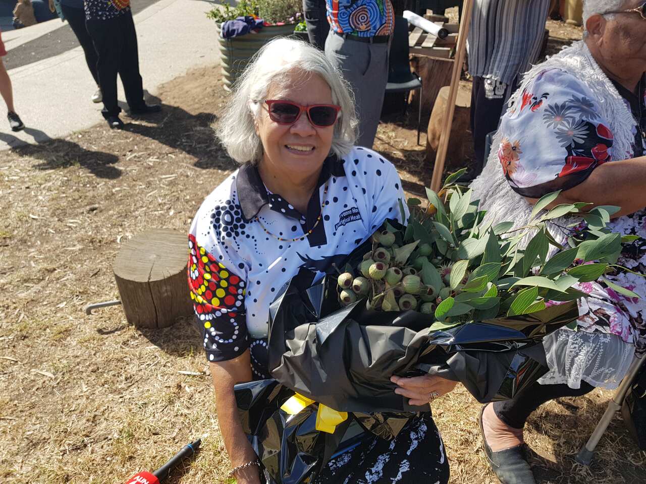 Woman holds a bunch of gumnuts
