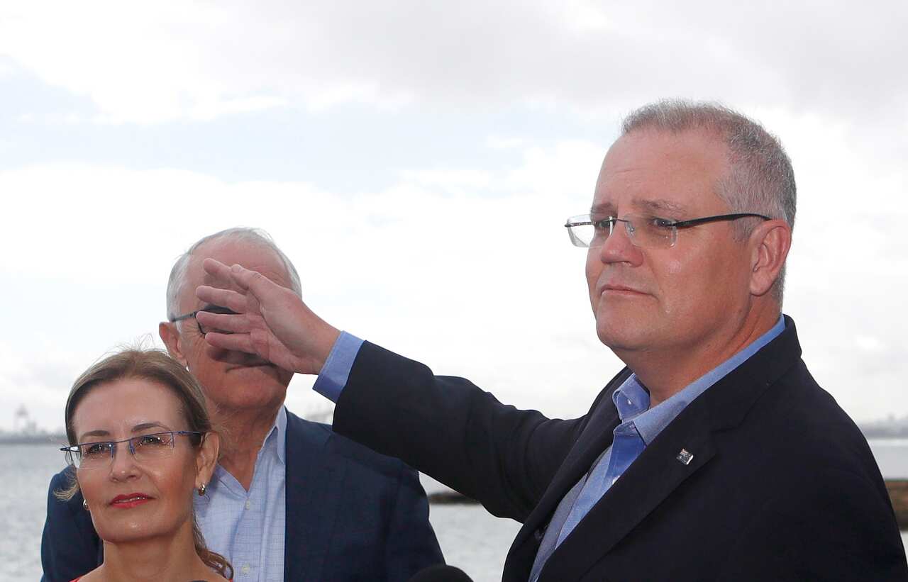 Treasurer Scott Morrison with Prime Minister Malcolm Turnbull (behind) during a press conference at Kurnell, Sydney, Saturday, April 28, 2018. Mr Turnbull announced the Australian and NSW Governments will together commit $50 million to upgrade the histori