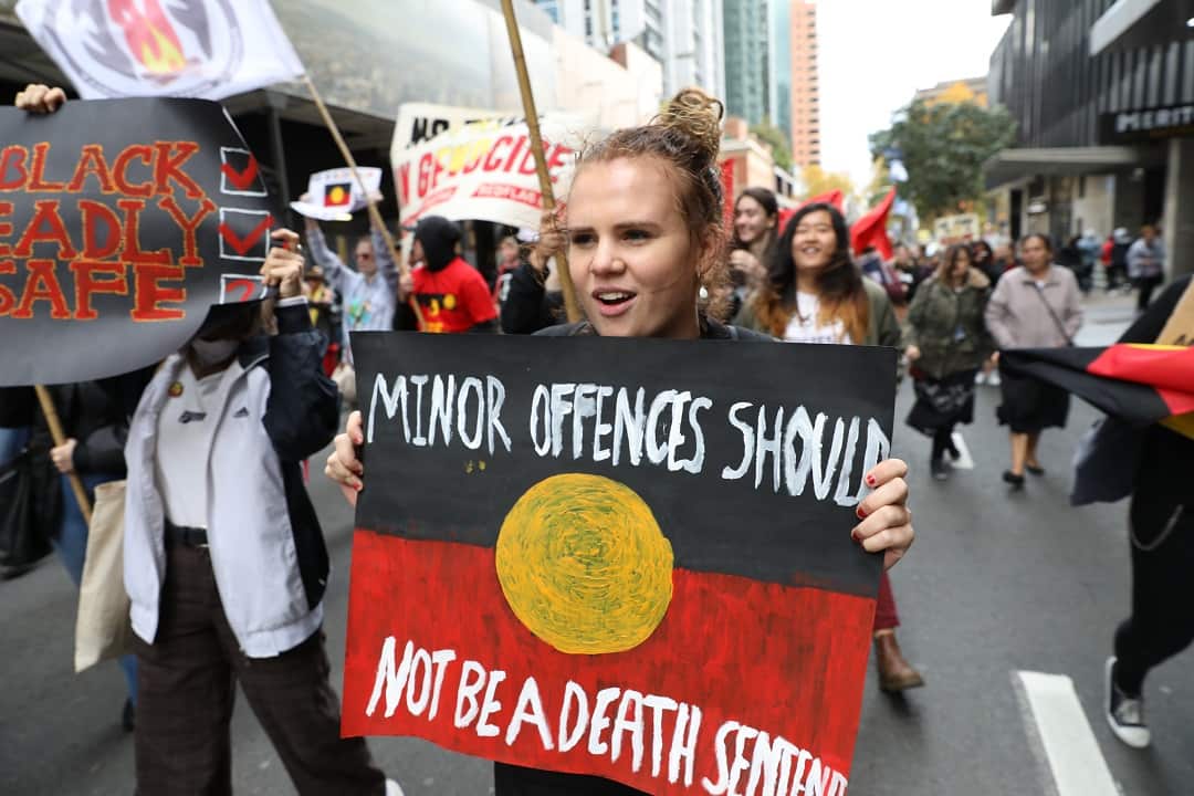 Woman at the rally with a sign