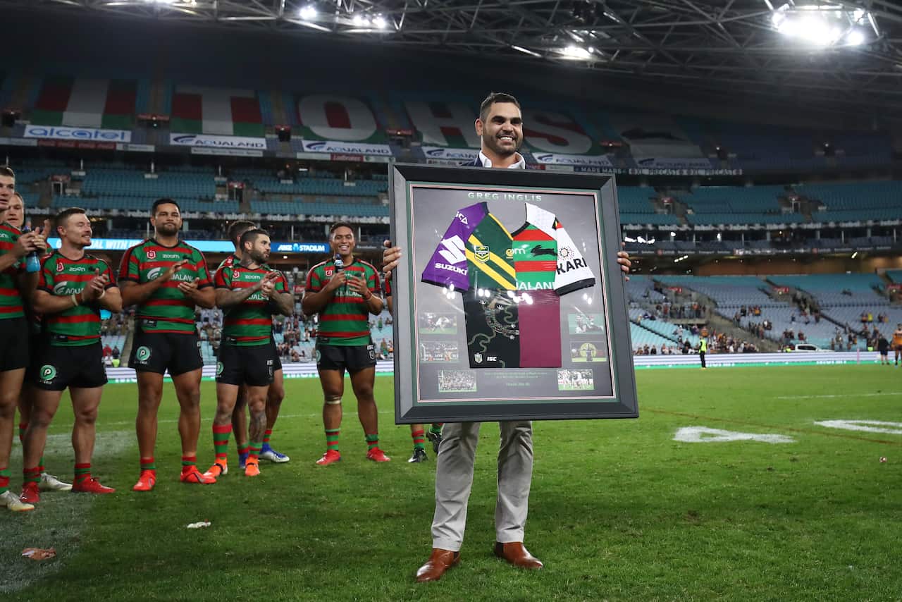 Greg Inglis poses with commemorative jersey 