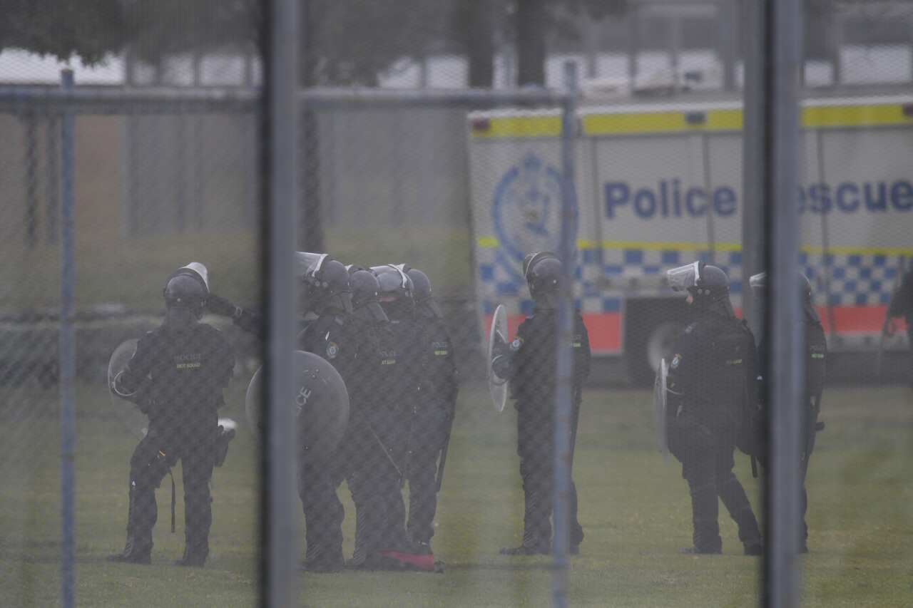 Riot Police are seen during a riot at the Frank Baxter Juvenile Justice Centre, Kariong, NSW, Monday, July 22, 2019. 