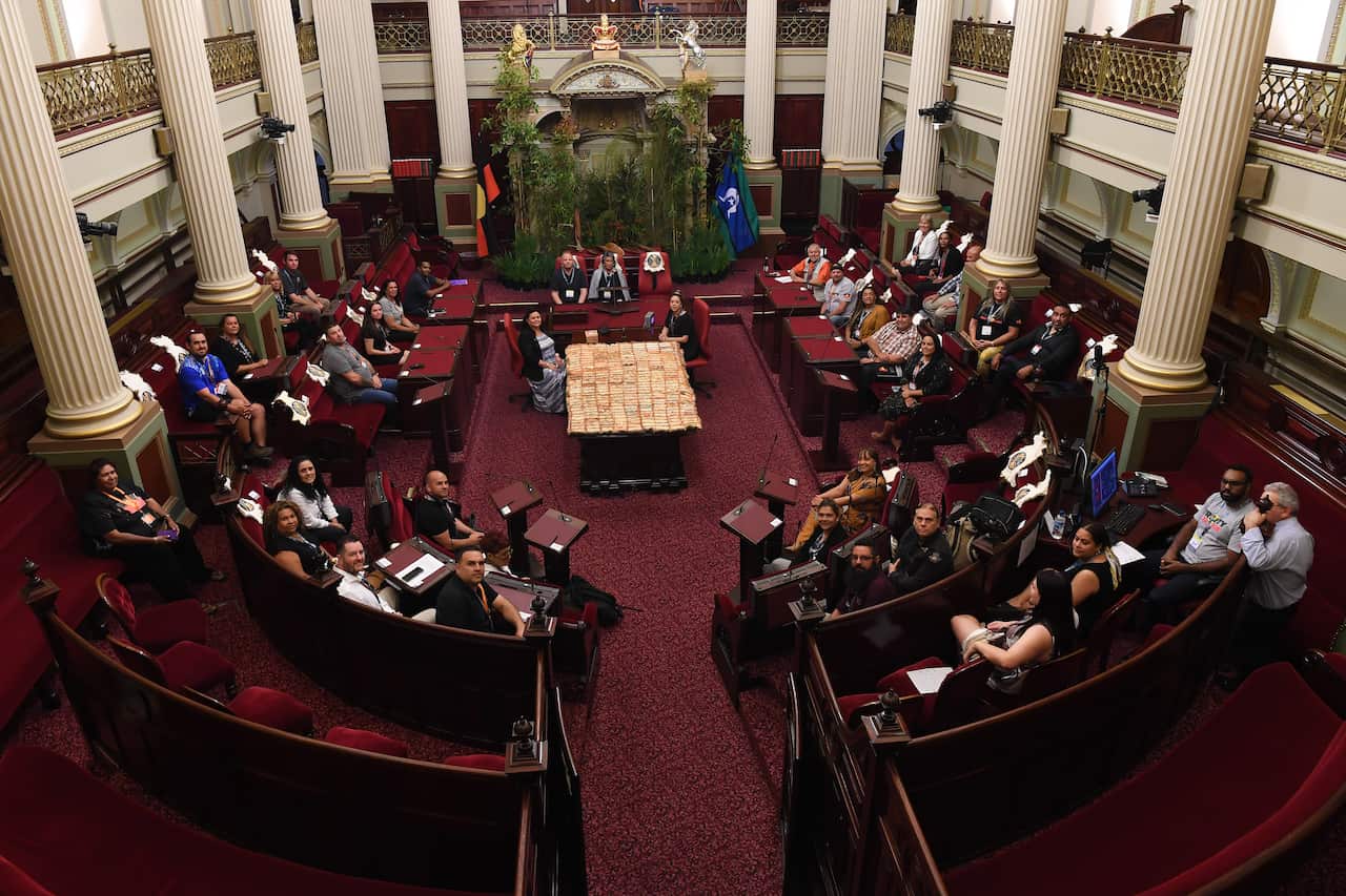 First Peoples' Assembly members pose for a photograph during the First Peoples' Assembly of Victoria inaugural meeting at The Parliament of Victoria in Melbourne, Monday, December 9, 2019. (AAP Image/James Ross) NO ARCHIVING