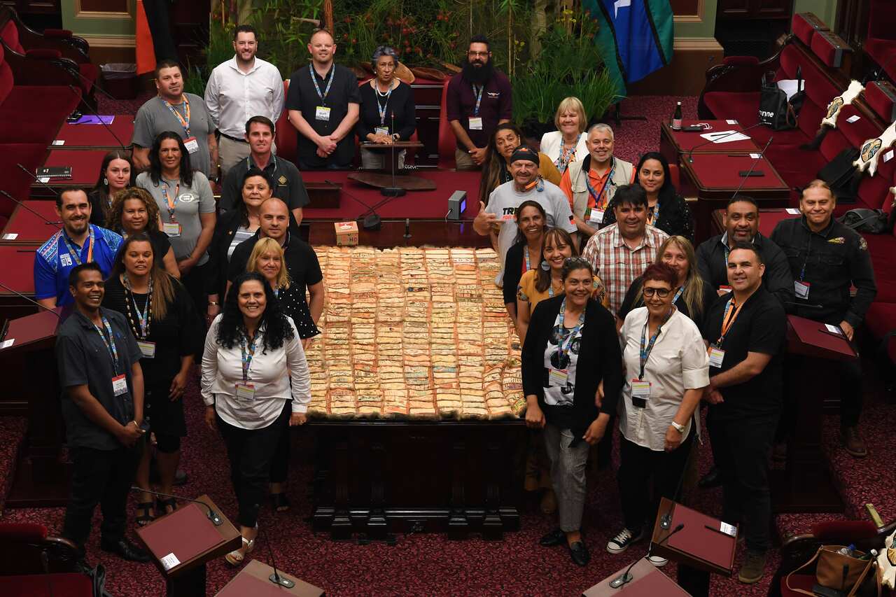 First Peoples' Assembly members pose for a photograph during the First Peoples' Assembly of Victoria inaugural meeting at The Parliament of Victoria in Melbourne, Monday, December 9, 2019. (AAP Image/James Ross) NO ARCHIVING