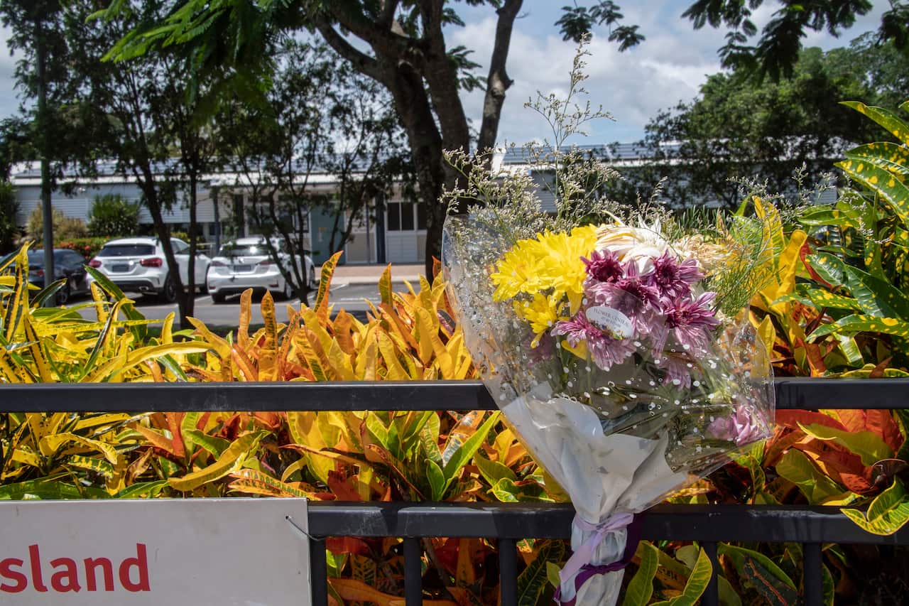 A floral tribute left at Hambledon State School  to remember the three year old boy who died  when  left in a day care minibus at Edmonton.