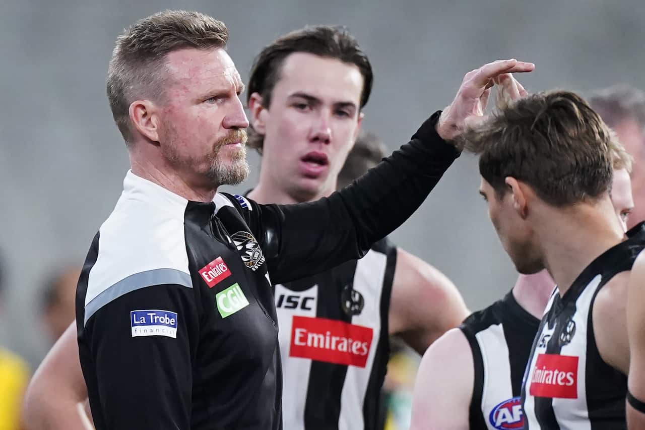 Nathan Buckley speaks to his players during the match between Collingwood and Richmond at the MCG in Melbourne, Thursday, June 11, 2020.