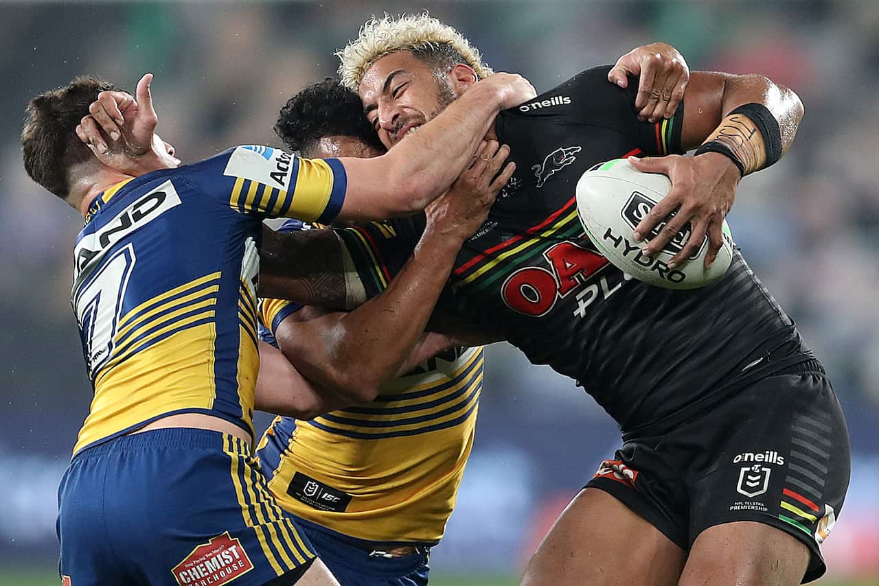 Viliame Kikau of the Panthers is tackled during the Round 5 NRL match between the Parramatta Eels and Penrith Panthers at Bankwest Stadium in Sydney, Friday, June 12, 2020.  (AAP Image/Brendon Thorne) NO ARCHIVING, EDITORIAL USE ONLY