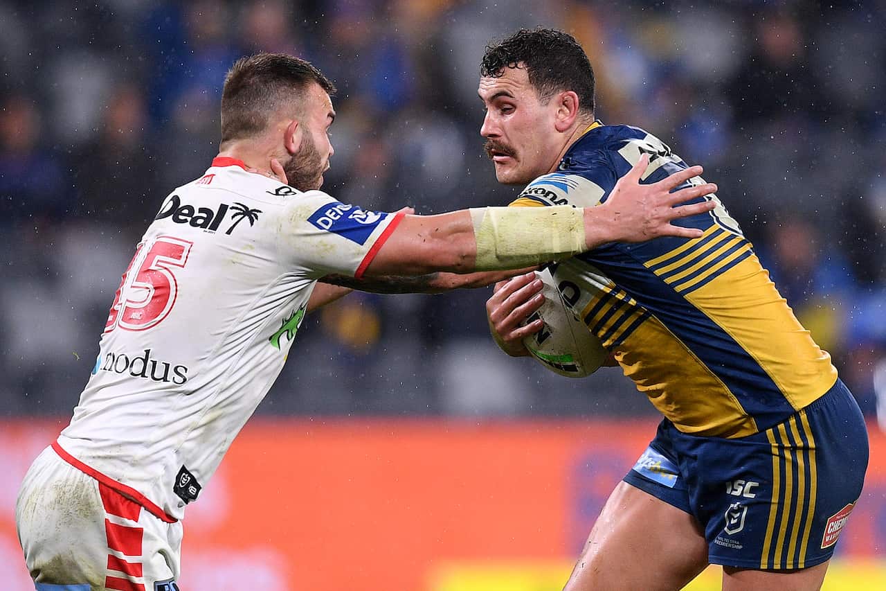 Reagan Campbell-Gillard of the Eels is tackled by Kaide Ellis of the Dragons during the Round 14 NRL match.