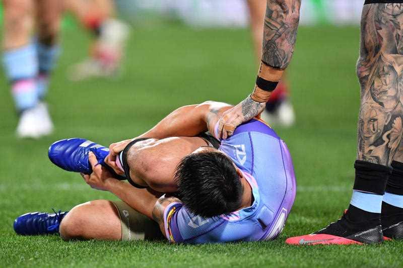 An injured Shaun Johnson of the Sharks during the Round 19 NRL match between the Sydney Roosters and the Cronulla Sutherland Sharks at the SCG, Sydney, Saturday, September 19, 2020. (AAP Image/Dean Lewins)