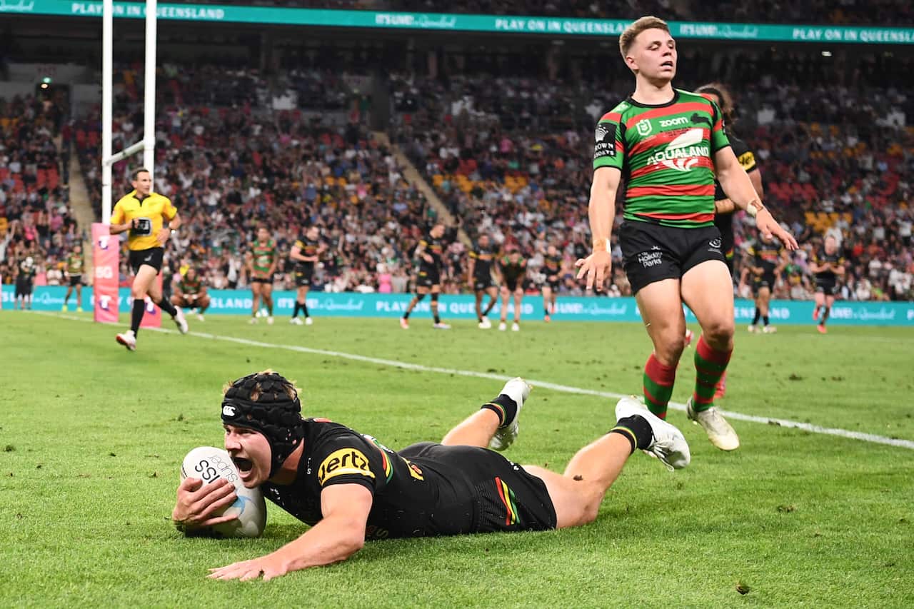 Panthers Matt Burton scores a try during the NRL Grand Final between the Penrith Panthers and South Sydney Rabbitohs at Suncorp Stadium in Brisbane, Sunday, October 3, 2021. (AAP Image/Dave Hunt) NO ARCHIVING, EDITORIAL USE ONLY