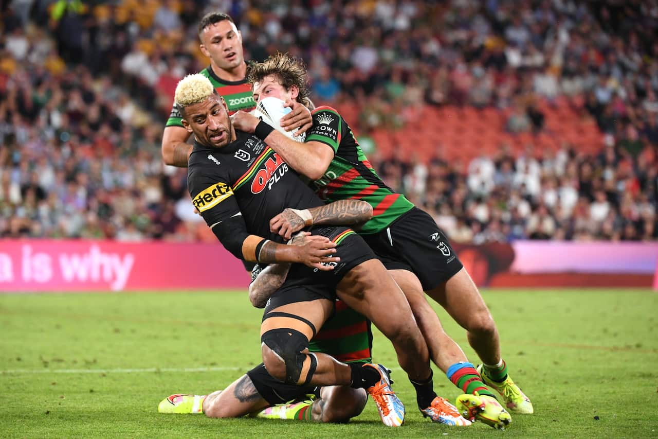 Panthers Viliame Kikau is tackled during the NRL Grand Final between the Penrith Panthers and South Sydney Rabbitohs at Suncorp Stadium in Brisbane, Sunday, October 3, 2021. (AAP Image/Dave Hunt) NO ARCHIVING, EDITORIAL USE ONLY