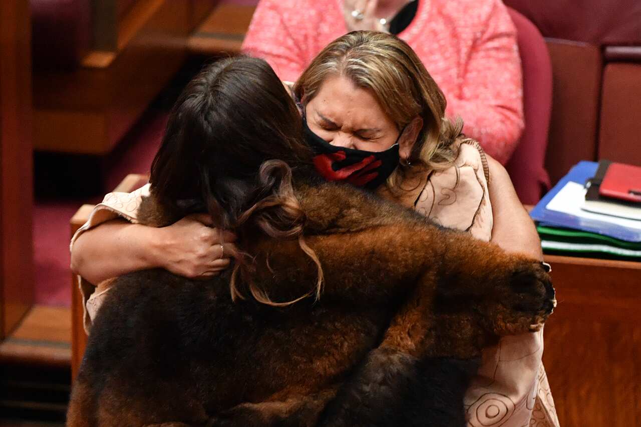 West Australian Greens Senator Dorinda Cox is hugged by fellow Senator Lidia Thorpe after a swearing in ceremony in the Senate Chamber at Parliament House in Canberra, Monday, October 18, 2021. (AAP Image/Mick Tsikas) NO ARCHIVING