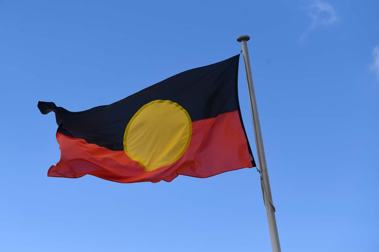 An Australian Aboriginal flag is seen in Canberra, Tuesday, February 4, 2022. (AAP Image/Lukas Coch) NO ARCHIVING