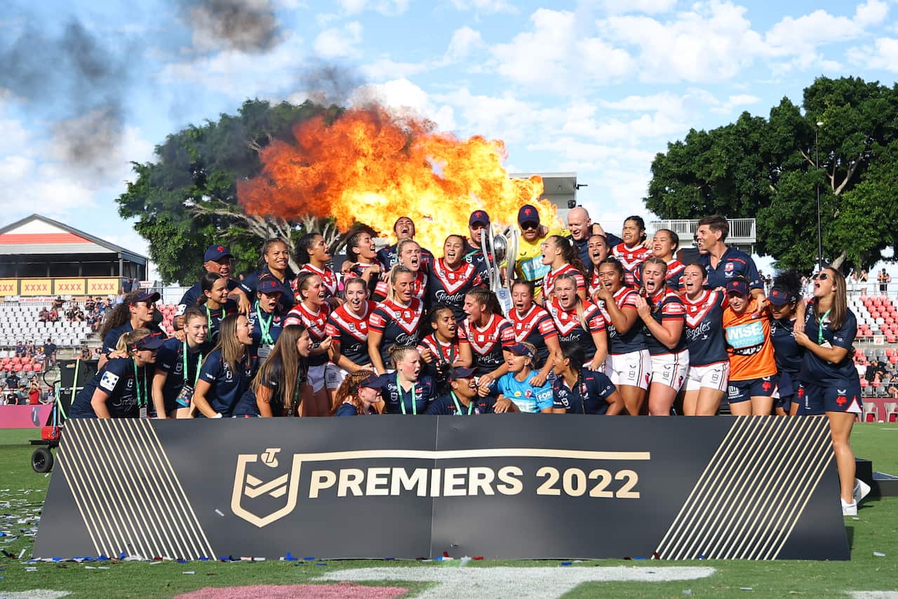 Sydney Roosters players celebrates after the NRLW Grand Final match between the St. George Illawarra Dragons and Sydney Roosters at Moreton Bay Stadium in Brisbane, Sunday, April 10, 2022. (AAP Image/Pat Hoelscher) NO ARCHIVING, EDITORIAL USE ONLY