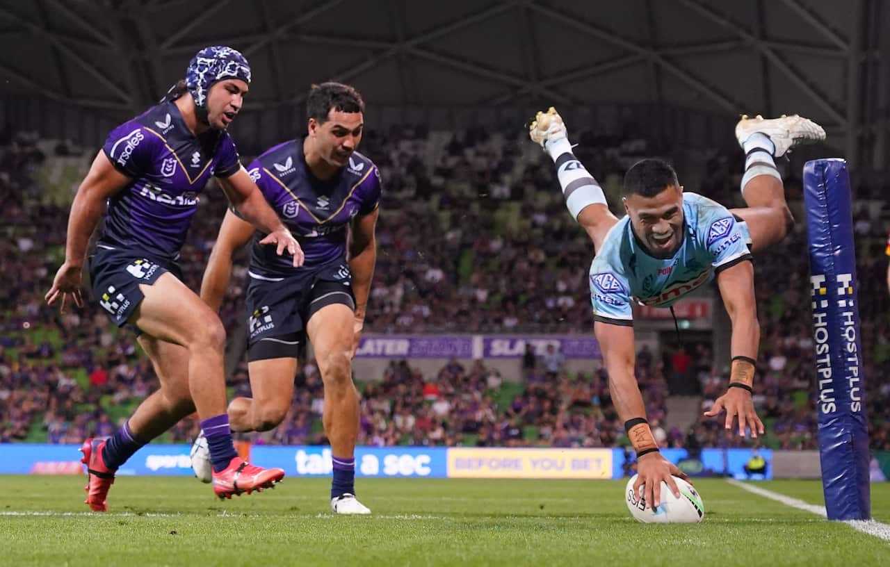 Ronaldo Mulitalo of the Sharks scores a try during the NRL Round 6 match between the Melbourne Storm and the Cronulla Sharks at AAMI Park in Melbourne, Saturday, April 16, 2022. (AAP Image/Scott Barbour) NO ARCHIVING, EDITORIAL USE ONLY