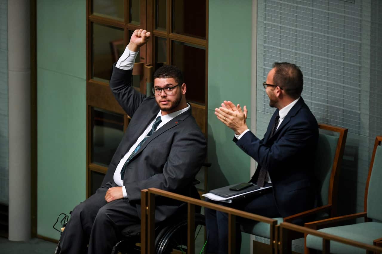 Australian Greens Senator Jordon Steele-John celebrates after the passing of the motion on the Disability Abuse Royal Commission