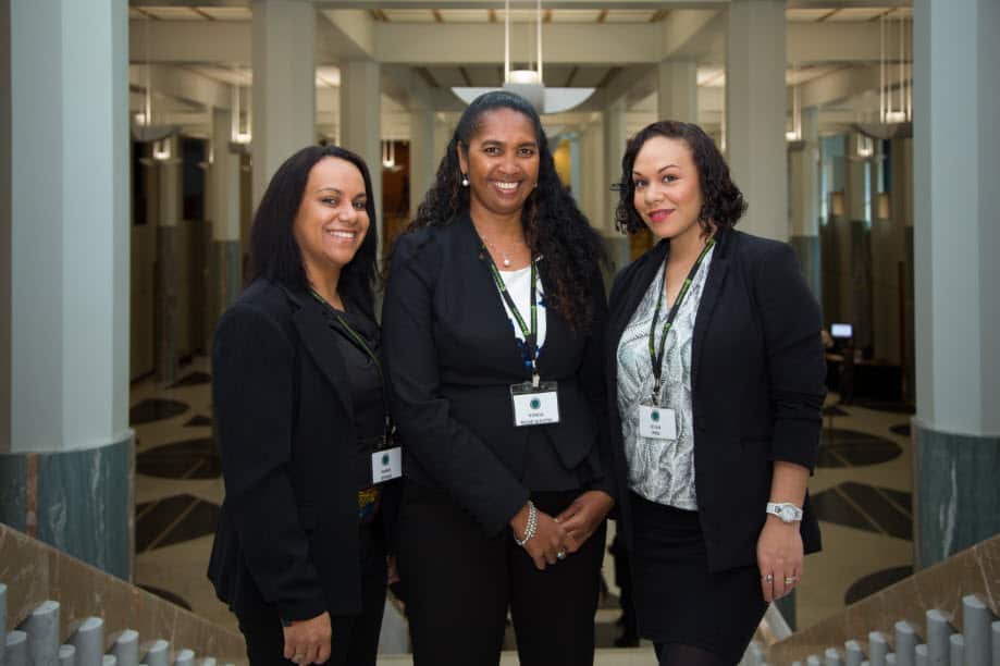 (L-R) Oxfam Straight Talk participants Marie Dennis and Lefan Jard stand either side of Vonda Malone. 