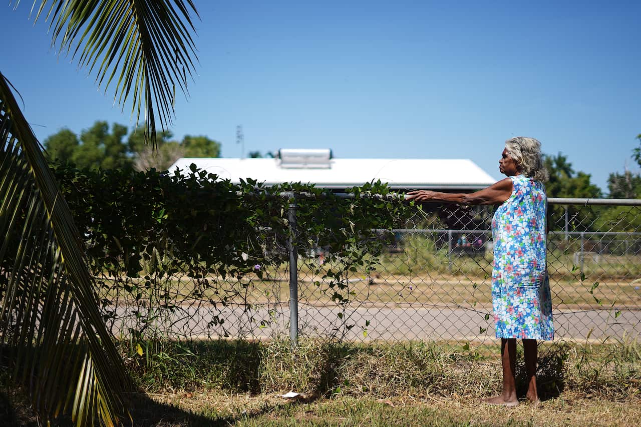 Helen Fejo-Frith standing at her back fence
