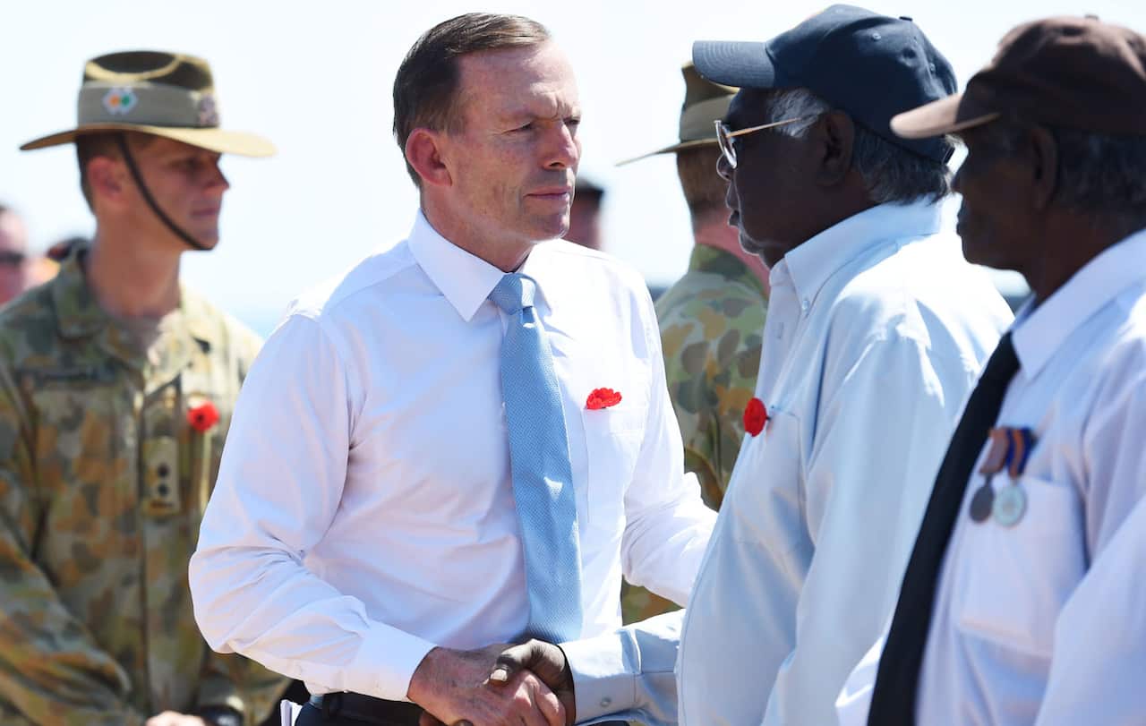Australian prime minister Tony Abbott farewells Garrawin Guamano after a memorial service to commemorate the 75th Anniversary of the commencement of World War 1 at Yirrkala on the Gove Peninsula, Northern Territory,