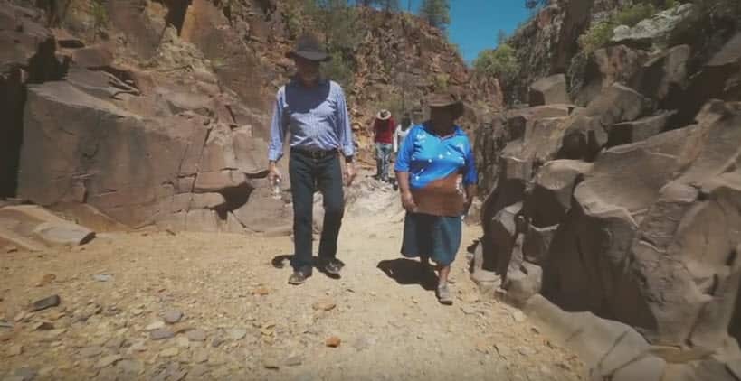 Uniting Church president Stuart McMillan (left) walks with Reverend Champion.