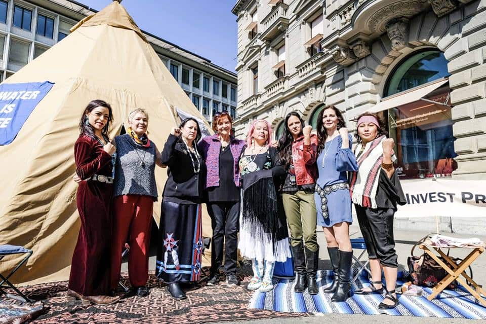 The delegation stands in front of the banks