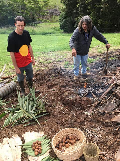 Bundjalung men, Marcus Ferguson and Oliver Costello, roasting black bean. 