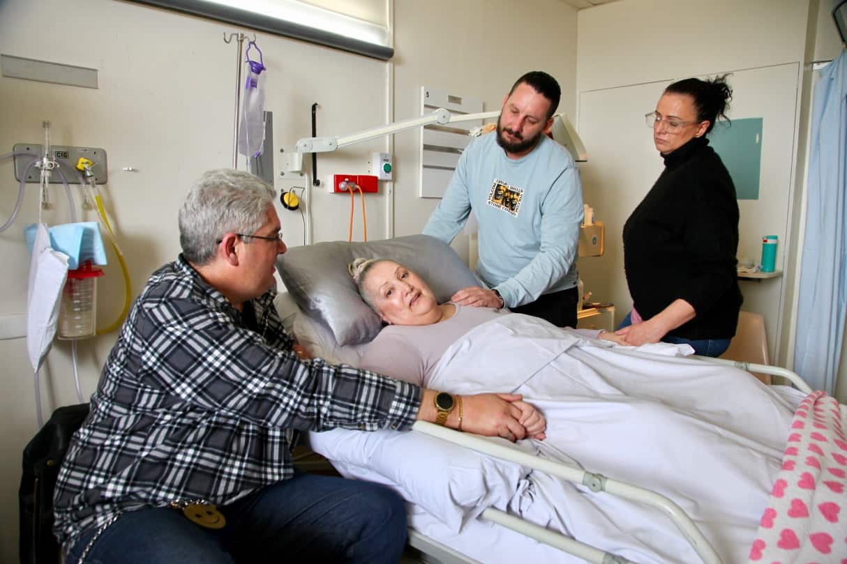 Mary-Ellen Passmore with her family in hospital the day before she died. 