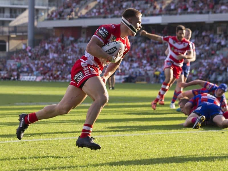 Euan Aitken of the Dragons scores during the Round 4 NRL match.