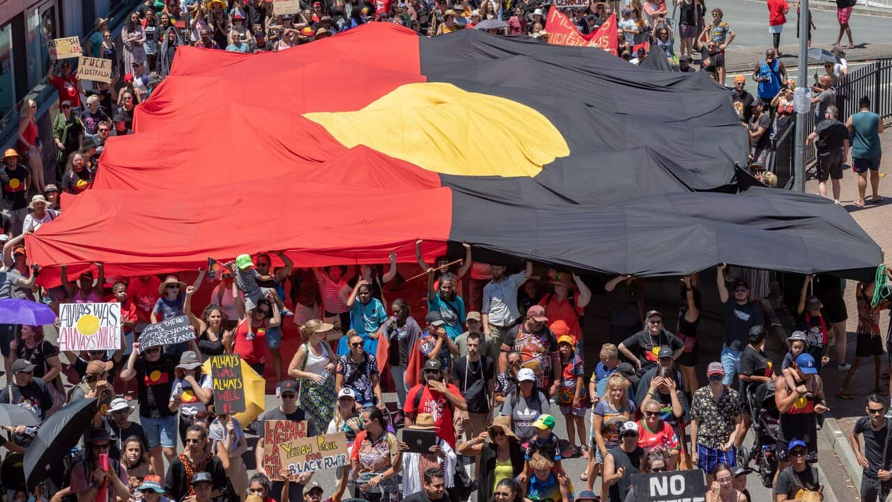 Invasion Day protesters are seen during the Australia Day celebrations in Brisbane.