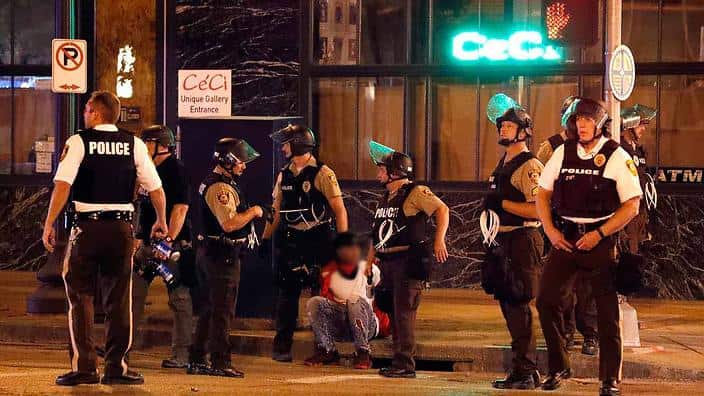 Police detain a man after a earlier peaceful protest in response to a not guilty verdict in the trial of former St. Louis police officer Jason Stockley.