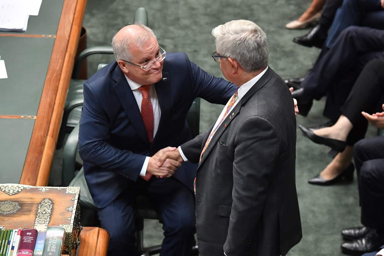 Prime Minister Scott Morrison shakes hands with Minister for Indigenous Australians Ken Wyatt