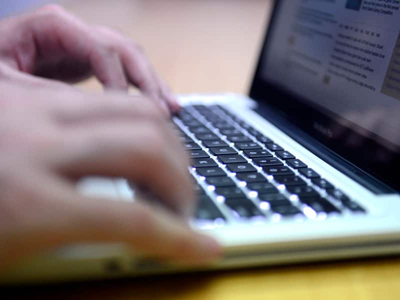 A man uses a laptop computer