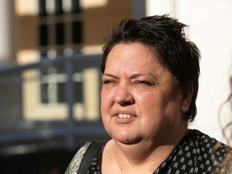 Witness Tracey Walsh leaves after giving evidence