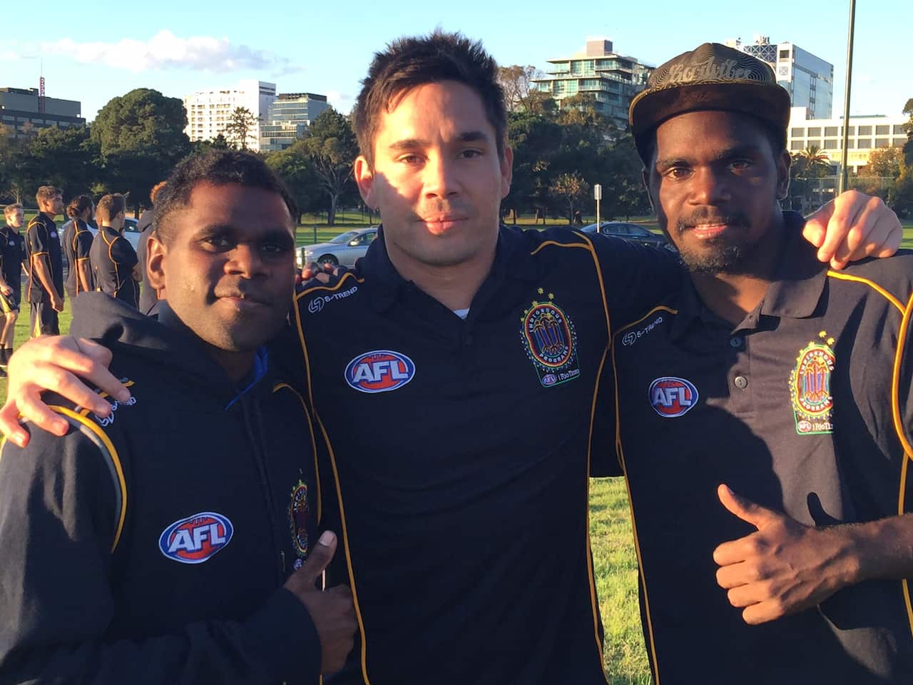 Former AFL player Matthew Stokes (middle) amongst participants